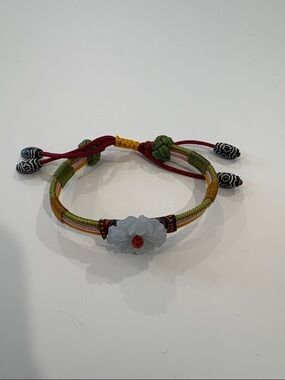 Handwoven Multicolor Cord Bracelet with Jade Flower and Red Bead